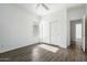 Bright and airy bedroom with neutral walls, closet, and tile flooring at 40504 N Territory Trl, Anthem, AZ 85086