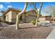 Charming single-story home featuring low maintenance desert landscaping and neutral color palette at 40504 N Territory Trl, Anthem, AZ 85086