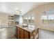 Charming kitchen island featuring granite counters and a rustic wood base design at 40504 N Territory Trl, Anthem, AZ 85086