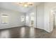 Main bedroom featuring vaulted ceiling, wood-look tile flooring, and ensuite bath at 40504 N Territory Trl, Anthem, AZ 85086