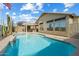 A sparkling pool and landscaped backyard for outdoor relaxation and entertainment at 40504 N Territory Trl, Anthem, AZ 85086