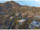 A scenic aerial view shows the neighborhood with desert vegetation surrounded by rocky mountains at 42237 N 107Th Pl, Scottsdale, AZ 85262