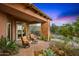 Outdoor living space with stone pillar detail and desert landscaping at 42237 N 107Th Pl, Scottsdale, AZ 85262