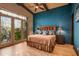 Beautiful bedroom with wood floors, vaulted ceilings, and natural light at 42237 N 107Th Pl, Scottsdale, AZ 85262