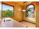 Bonus room with stone countertops, sink, and bright windows with an outdoor view at 42237 N 107Th Pl, Scottsdale, AZ 85262