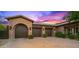 Beautiful home exterior featuring three-car garage and stunning architecture at 42237 N 107Th Pl, Scottsdale, AZ 85262