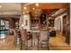 Gourmet kitchen bar with premium finishes and seamless flow to dining area at 42237 N 107Th Pl, Scottsdale, AZ 85262