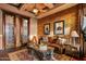 Inviting living room with leather seating, decorative rug, and rustic accents for a cozy feel at 42237 N 107Th Pl, Scottsdale, AZ 85262