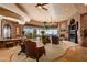 Expansive living room featuring a fireplace, stone accents, and panoramic views at 42237 N 107Th Pl, Scottsdale, AZ 85262