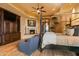 Spacious main bedroom boasts hardwood floors, a fireplace, and a sitting area at 42237 N 107Th Pl, Scottsdale, AZ 85262