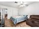 Cozy bedroom featuring a ceiling fan and sliding door closet at 4401 W Lewis Ave, Phoenix, AZ 85035