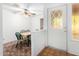 Bright dining area adjacent to the front door with a unique patterned glass insert at 4401 W Lewis Ave, Phoenix, AZ 85035