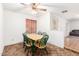 Dining area featuring a ceiling fan and a view into the home at 4401 W Lewis Ave, Phoenix, AZ 85035