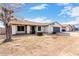 Inviting single-story house with a cozy front yard under a clear sky at 4401 W Lewis Ave, Phoenix, AZ 85035