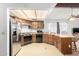 Well-lit kitchen featuring stainless steel refrigerator and modern appliances at 4401 W Lewis Ave, Phoenix, AZ 85035