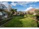 Wide green backyard with trimmed hedges and a mountain in the background at 4716 N Dromedary Rd, Phoenix, AZ 85018