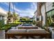 Cozy patio swing overlooking a well-manicured backyard with a pool and mountain views at 4716 N Dromedary Rd, Phoenix, AZ 85018