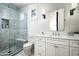 Sleek bathroom showcasing a glass-enclosed shower, a modern vanity with white countertops and cabinetry at 4716 N Dromedary Rd, Phoenix, AZ 85018