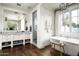 Bathroom featuring a soaking tub, glass shower, double sinks, and sleek fixtures at 4716 N Dromedary Rd, Phoenix, AZ 85018