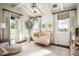 Warm Bedroom with exposed beam ceiling, adorned with a charming crib and a decorative tree at 4716 N Dromedary Rd, Phoenix, AZ 85018