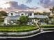 Aerial view of a large, well-maintained home with manicured lawns, trimmed hedges, and mature trees at 4716 N Dromedary Rd, Phoenix, AZ 85018