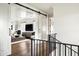 Open hallway with barn doors, hardwood floors, and a view of the living area at 4716 N Dromedary Rd, Phoenix, AZ 85018