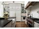 Bright kitchen featuring stainless steel appliances, stone countertops, and farmhouse sink at 4716 N Dromedary Rd, Phoenix, AZ 85018