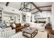 Open-concept living room with exposed beams, comfortable seating, and seamless flow to the kitchen at 4716 N Dromedary Rd, Phoenix, AZ 85018