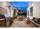 Outdoor kitchen featuring stainless steel grill, gravel patio, and mountain views at 4716 N Dromedary Rd, Phoenix, AZ 85018