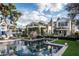 A backyard pool featuring a slide, playhouse, stone accents, and a beautiful view of the home at 4716 N Dromedary Rd, Phoenix, AZ 85018