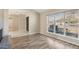 Bright living room featuring wood floors and a large window at 5013 W Orchid Ln, Glendale, AZ 85302