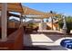 Outdoor living space with shade canopies and a view of the backyard pool at 5622 E Emerald Cir, Mesa, AZ 85206