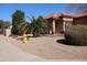 Well-maintained single-story home featuring desert landscaping, neutral tones and a 2-car garage at 5622 E Emerald Cir, Mesa, AZ 85206