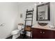 Stylish bathroom with a vessel sink, custom wood shelf, and tiled floors at 5761 E Tierra Buena Ln, Scottsdale, AZ 85254