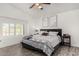 Charming main bedroom features a vaulted ceiling, a ceiling fan, and a large window at 5761 E Tierra Buena Ln, Scottsdale, AZ 85254