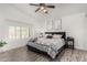 Charming main bedroom features a vaulted ceiling, a ceiling fan, and a large window at 5761 E Tierra Buena Ln, Scottsdale, AZ 85254