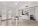 Charming breakfast nook with seating, coffee bar, and abundant light from French doors at 5761 E Tierra Buena Ln, Scottsdale, AZ 85254