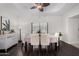 Open dining area features bright, natural lighting from the big window and neutral accents at 5761 E Tierra Buena Ln, Scottsdale, AZ 85254