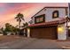 Charming two-story home with a red tile roof, two car garage, and a low maintenance desert landscape at 5761 E Tierra Buena Ln, Scottsdale, AZ 85254