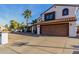 Charming two-story home with a red tile roof, two car garage, and a low maintenance desert landscape at 5761 E Tierra Buena Ln, Scottsdale, AZ 85254