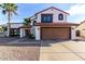 Charming two-story home with a red tile roof, two car garage, and a low maintenance desert landscape at 5761 E Tierra Buena Ln, Scottsdale, AZ 85254