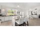 Bright kitchen featuring a window, kitchen island, stainless appliances, and an attached breakfast nook at 5761 E Tierra Buena Ln, Scottsdale, AZ 85254