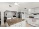 Bright kitchen features stainless steel appliances and granite countertops on a large center island at 5761 E Tierra Buena Ln, Scottsdale, AZ 85254