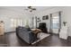 Bright and airy living room featuring a large sectional sofa, hardwood floors, and natural light at 5761 E Tierra Buena Ln, Scottsdale, AZ 85254