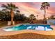 Enjoy this beautiful backyard pool surrounded by lush greenery and lounge chairs for relaxation at 5761 E Tierra Buena Ln, Scottsdale, AZ 85254