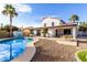 Private backyard featuring a sparkling pool and outdoor seating area amidst mature landscaping at 5761 E Tierra Buena Ln, Scottsdale, AZ 85254