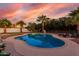 Inviting backyard pool with clear blue water, lounge chairs, and mature palm trees at 5761 E Tierra Buena Ln, Scottsdale, AZ 85254