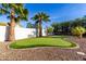 Backyard putting green surrounded by mature trees offering a relaxing recreational space at 5761 E Tierra Buena Ln, Scottsdale, AZ 85254