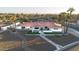 Expansive aerial view of a single-story home showcasing its manicured lawn, red tile roof, and welcoming curb appeal at 5801 N 22Nd Pl, Phoenix, AZ 85016