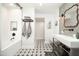 Modern bathroom featuring a floating vanity, subway tile, and unique star pattern floor at 5801 N 22Nd Pl, Phoenix, AZ 85016